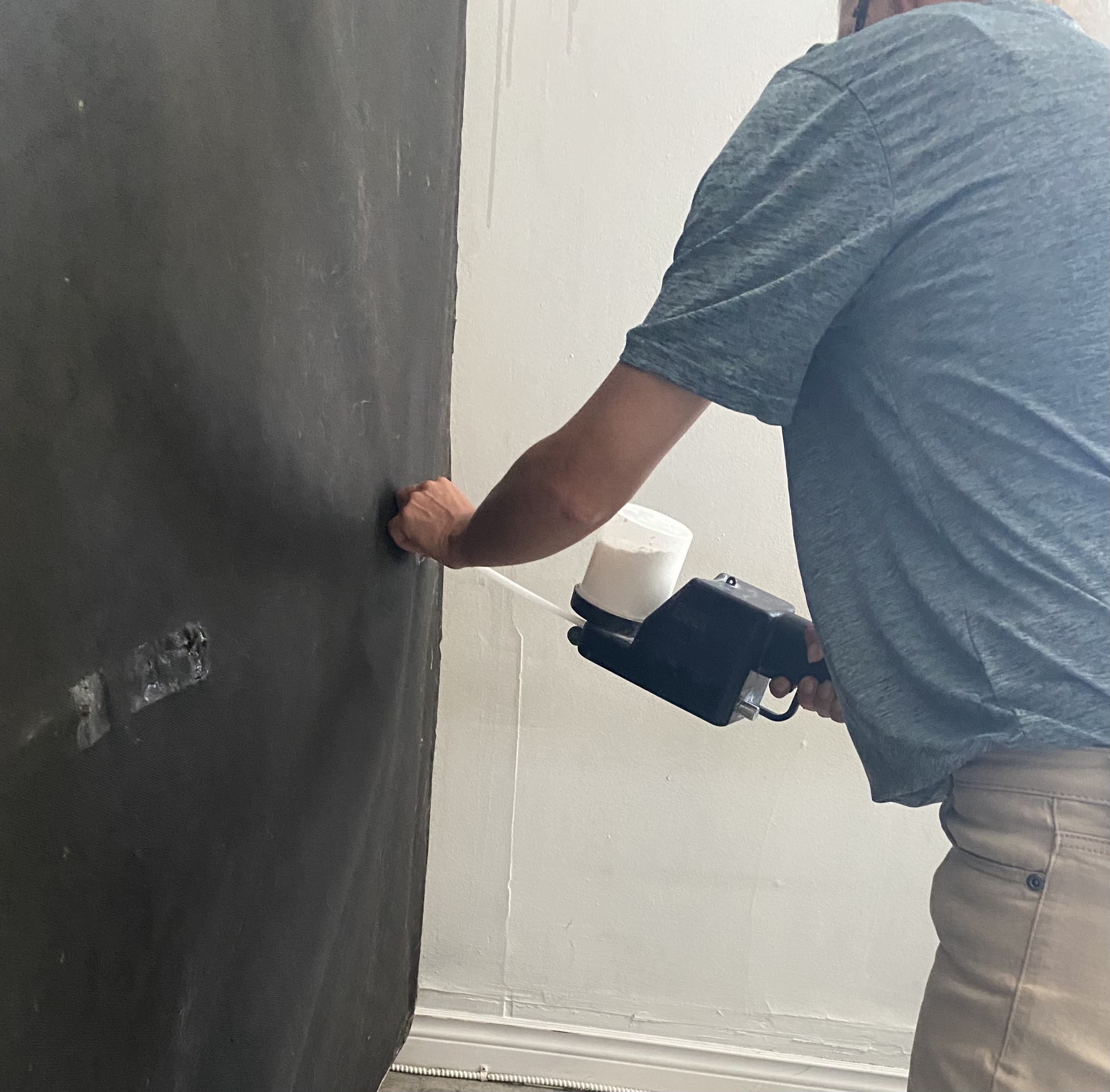 A picture of a KW Pest technician exterminating bed bugs